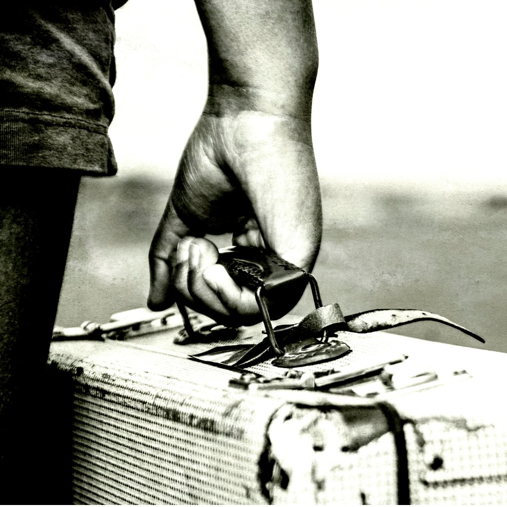 refugee-girl-with-her-suitcase-close-up-bw-picture-id1178013566